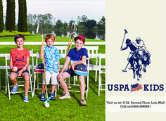 three children sitting on chairs in front of a field with an american flag and the words uspa kids