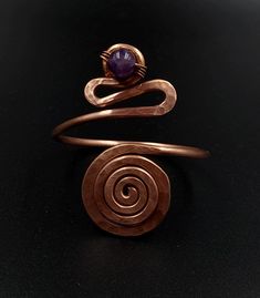 This is an adjustable, massive bracelet made of raw and pure copper with natural amethyst.  Large spiral diameter: 3.5 cm. It can be worn on the wrist or forearm. Adjustable circumference: 16-23 cm Dacian inspiration. It can be made to order, any size. Wearing copper jewelry can leave greenish marks on the skin, that can be cleaned with soap and water. Wearing copper jewelry can stimulate healing, especially due to its ability to balance polarities or, in other words, the flow of projective and receptive energies. Nowadays, jewelry and ornaments made of pure copper are worn for healing and to prevent illness, with this therapy being called cuprotherapy. The health benefits of copper include better functioning of the body and improved health of connective tissues, hair, and eyes. It regulat Healing Jewelry, Copper Bracelet, Hammered Copper, Pure Copper, Copper Jewelry, How To Make Ornaments, Natural Healing, Bracelet Making, Jewelry Crafts