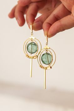 A geometric, minimalist earring design made with a statement hexagonal, hollow, hand-blown glass bead and 14k gold plated accessories.  Available in 4 colours: Apricot, Gray, Green and Teal. For more glass bead designs, do check out our store listings! As all items are handmade, there may be imperfections, such as slight differences in colour and measurements.  Upon receiving your order, your packages will be shipped out within 1-3 working days. Some designs are made-to-order, and we want to ens Modern 14k Gold Filled Earrings, Modern 14k Gold Filled Earrings With Ear Wire, Modern Linear Drop Earrings For Jewelry Making, Modern 14k Gold Filled Linear Earrings Gift, Geometric Sun, Geometric Earrings, Sun Catcher, Bead Designs, Jewelry Projects