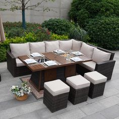 an outdoor dining table with six chairs and four stools