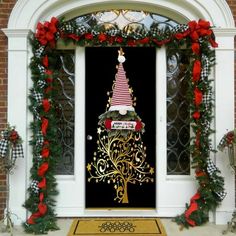 a decorated christmas tree on the front door