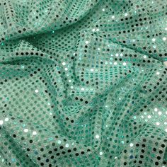 green and black sequinized mesh fabric