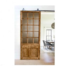 a wooden cabinet with glass doors in a room