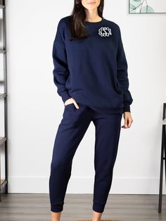 Don't sweat the small stuff in life. Live in comfort and enjoy the journey in this sweatshirt and pant set. It will be the first thing you put on when you walk in the door every day! Features a solid ribbed hem, soft fleece lining, large pockets, drawstring pants. Navy Set - Model is wearing a size M. 53% Cotton, 45% Polyester, 2% Spandex. Size Chart Don't Sweat The Small Stuff, Enjoy The Journey, Small Stuff, Jogger Set, Pant Set, Drawstring Pants, The Door, Put On, The Journey