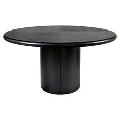 a round table with black wood grained finish on the top and base, in front of a white background