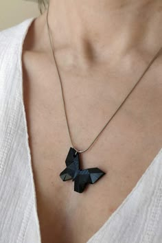 A lovingly necklace with a handmade pendant made from resin. Painted white or black. Thanks for looking, any questions please message me! Diy Paper Necklace, Black Butterfly Charm Jewelry, Black Butterfly-shaped Jewelry For Gift, Black Butterfly Jewelry For Gift, Modern Black Geometric Necklace, Geometric Black Jewelry For Gifts, Unique Black Geometric Jewelry, Elegant Black Butterfly Necklace Gift, Minimalist Handmade Black Necklace