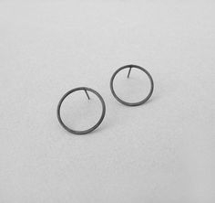 Open circle silver earrings, Oxidized black round circle post earrings, geometric jewelry, everyday earrings, gifts under 20 This pair of open circle post earrings are easy to wear everyday and can match any outfit. A geometric and minimalist design you will love everyday! These are hand formed from sterling silver wire and oxidized with patina. You can choose the diameter of the circle is either 15 mm (0.6''), 20 mm (0,8'') or 43 mm (1,7'') . You can also choose to have them either black oxidiz Minimalist Pierced Open Circle Jewelry, Minimalist Pierced Open Circle Earrings, Minimalist Open Circle Pierced Earrings, Modern Everyday Circular Earrings, Minimalist Circle Earrings As Gift, Minimalist Black Round Hoop Earrings, Minimalist Hypoallergenic Circle Earrings, Modern Everyday Circular Hoop Earrings, Minimalist Hypoallergenic Open Circle Earrings