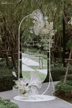 a wedding arch with flowers on it