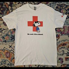 Show Off Your Love For The Peanuts Gang With This Limited Edition Be Cool Give Blood Snoopy Red Cross T-Shirt. Featuring Snoopy Or Joe Cool Characters, This White Tee Has A Solid Pattern And Short Sleeves With A Crew Neckline. It's A Unisex Adult Size M, And Has A Regular Fit For All Body Types. Red Cartoon Print T-shirt With Short Sleeves, Snoopy Tshirts, Red Cartoon Print Crew Neck T-shirt, Cool Characters, Snoopy T Shirts Vintage, Snoopy Shirt, Cross Shirt, Snoopy Tshirt Redbubble, Cross Shirts