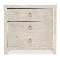 a white dresser with two drawers and handles on it's sides, against a white background