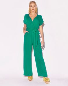 Introducing your next favorite Meg Fab wardrobe staple, the Wonderland Jumpsuit! Inspired by the best selling Jasmine Maxi Dress and designed for the party Queen on the go, this fabulous jumpsuit transitions seamlessly from the boardroom to bar scene in a snap. This easy to wear jumpsuit features a sexy cross front V-shaped neckline with short, capped rolled sleeves. The back has a cross-over, key hole back styling with button and loop closure at the top neckline. The true waist has an elastic g Rayon Crinkle, Top Neckline, Party Queen, Bar Scene, Rolled Sleeves, Medium Dress, Denim Bag, Key Hole, Dress Pant