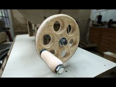 a wooden reel is sitting on a table