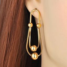 Material: Stainless Steel, Gold Plated Size: 2 inch by 0.7 inch (5.2 cm by 1.7 cm) Weight per pair: 0.4 oz (11 g) Design: Balls on a Chain Dangle Drop Earrings Color: Yellow Gold Travel Inspired Jewelry, G Design, Travel Inspired, Plate Size, Dangle Drop Earrings, Gold Plate, Size 2, Yellow Gold, Plating