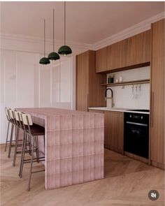 an image of a kitchen setting with bar stools