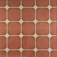 an orange and white tiled wall with circles on it