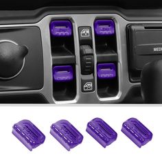 four purple buttons on the center console of a vehicle