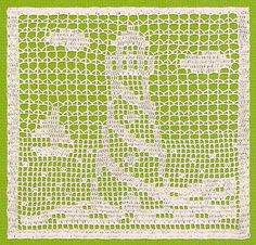 a green and white doily with the word love written in small letters on it