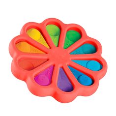 an orange flower shaped plastic toy with multicolored spoons in it's center