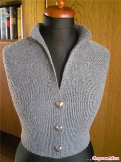 a mannequin wearing a gray sweater with buttons