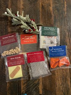 several packaged snacks on a wooden table with dried herbs and other items in plastic bags