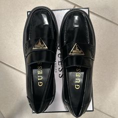 Black And Gold Guess Loafers Guess Loafers, Trendy Black Slip-ons For Formal Occasions, Black Low-top Platform Loafers For Formal Occasions, Black Low-top Platform Loafers For Formal Events, Classic Black Low-top Platform Loafers, Black Low-top Loafers For Work, Guess Shoes, Loafer Flats, Flat Shoes Women