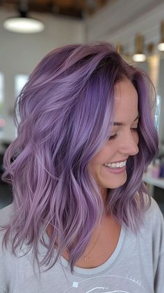 25 Prettiest Purple Hair Color Ideas To Make Your Hair Pop Lavender Ombré Hair, Lavender Halo Hair, Blonde To Lavender Hair, Purple Hair Blonde Money Piece, Light Purple Blonde Hair, Purple Gray Hair Color, Purple Hair On Blonde, Peach And Purple Hair, Hair With Pop Of Color