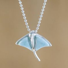 This necklace handcrafted by Thai artisan Michael Krainer features a lovely stingray pendant. The stingray's wing-like fins are made of larimar set in sterling silver. Larimar Pendant, Jewelry Workshop, Cz Pendant, Mens Pendant, Crystal Necklace Pendant, Fantasy Jewelry, Girly Jewelry, Stingray, Jewelry Packaging