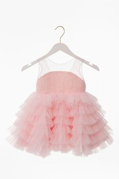 Pink pearl dress with super soft fluffy skirt. You will like the quality of both fabric and the labor. Can be used as a birthday dress or for any special occasion. Pearls on body by hand beaded(NOT Machine Made) Cotton lining touches your baby which is super soft. She will be a real princess in your/her special day! Festive Sleeveless Tulle Dress, Elegant Sleeveless Tutu Dress For Festive Occasions, Pink Princess Christmas Dress, Fitted Sleeveless Tulle Holiday Dress, Holiday Princess Sleeveless Dress For Parties, Holiday Sleeveless Princess Dress For Party, Holiday Party Sleeveless Princess Dress, Sleeveless Holiday Princess Dress For Party, Christmas Princess Dress In Pink