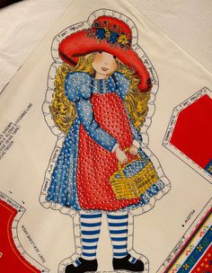 an image of a child's paper doll on top of other sewing materials