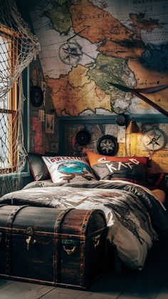 a bedroom with a map on the wall and an old trunk in front of it