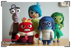 the crochet dolls are all dressed in different colors