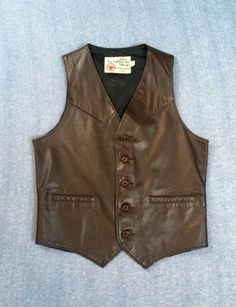 Brown leather vest by The Leather shop Sears, has lined brown leather front and back, 2 pockets  and western styling. Size 38R Please note measurements: chest 38" waist  34" back length from center nape 20.5" front length from shoulder to point  23.5" Brown Leather Vest, Style Vest, Leather Vest, Leather Shops, Vintage Button, Western Style, Vest Dress, Western Fashion, Brown Leather