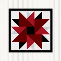 a red and black star quilt on a white wall