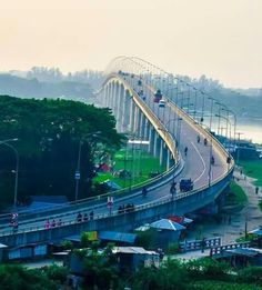 an aerial view of a bridge with cars driving on it