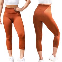 Astoria Activewear Seamless 3/4 Length Leggings In Burnt Orange High Waist Crop Mid Calf Length Supportive Compression Rib Knit Waistband Ribbed Side Stripe Details Crotch Gusset No Front Seam Means No Camel Toe Sweat-Wicking Quick Dry Poly/Spandex Thick Squat Proof Performance Stretch Fabric Figure Flattering Comfortable Second Skin Fit Measurements In Pics Women’s Medium Nwt New No Flaws Spring Yoga Sportswear Athleisure Workout Gym Cycling Instagram Fitness Influencer Blogger Favorite Brown Seamless Activewear, Solid Color Workout Capris, Brown Yoga Pants For Sports, High Waist Stretch Orange Activewear, Orange High Waist Stretch Activewear, High Stretch Capri Gym Bottoms, High Stretch Capri Length Gym Bottoms, High Stretch Seamless Brown Bottoms, Solid Capri Length Workout Bottoms