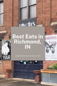 a sign that says best eats in richmond, in front of an old brick building