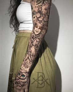 a woman with tattoos on her arm and arms