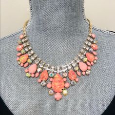 Be Pretty In Pink This Season And Instantly Update Your Wardrobe With This Beautiful Statement Necklace. This Iridescent Acrylic Crystal Necklace Shows Your On Trend With Glorious Pops Ab Crystals And Light Pink Stones. The Silhouette Of This Piece Is A Classic Favorite Because It Is So Easy To Wear. Sits Approximately 16-18” Adjustable Iridescent Acrylic Crystals Pink Rhinestone Jeweled Necklace For Parties, Pink Rhinestone Necklace For Party, Adjustable Coral Jewelry For Parties, Pink Rhinestone Party Necklaces, Pink Rhinestone Costume Jewelry Necklace, Pink Rhinestone Costume Jewelry Necklace For Gift, Pink Rhinestone Party Necklace, Elegant Pink Crystal Necklace For Party, Pink Crystal Necklace With Rhinestones