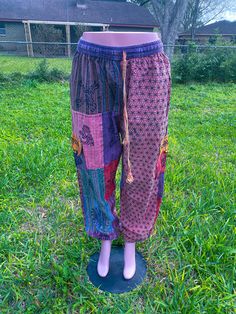 Handmade boho patchwork pant ethically made multicolored- multi patched harem pants 100 % organic cotton handmade drawstring with elastic waistband Stylish eye catching designs one size free size Waist unstretch 28 Waist stretched 50 Length 40/41 Hip 56 Thighs around 29/30 Inseam 29/30 Rise 16 Bohemian Cotton Bottoms With Floral Patchwork, Bohemian Cotton Pants With Floral Patchwork, Hippie Floral Patchwork Bottoms For Festival, Bohemian Floral Patchwork Bottoms For Festival, Pink Cotton Pants For Festival, Festival Cotton Patchwork Harem Pants, Festival Patchwork Cotton Harem Pants, Cotton Patchwork Harem Pants For Festival, Pink Bohemian Patchwork Bottoms