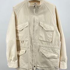 Snow Peak Takibi Canvas Jacket Size L Made In Japan 80% Cotton 20%. Modacrylic Fire Resident Material New Without Tags Shoulder To Shoulder: Rag Pit To Pit: 25in Sleeve Length: 20 Underarm Total Length: 30in / 33in White Long Sleeve Outerwear With Multiple Pockets, Beige Cotton Parka With Pockets, White Outerwear With Multiple Pockets For Spring, White Spring Outerwear With Multiple Pockets, Spring White Outerwear With Multiple Pockets, White Winter Utility Jacket, White Utility Jacket For Winter, Beige Utility Jacket With Pockets For Streetwear, Casual White Outerwear With Patch Pockets