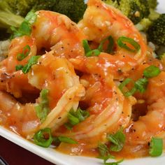 some shrimp and broccoli on a white plate