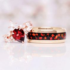 Red Fire Opal, Natural Red Garnet & Galaxy Blue Sandstone Couples Ring Set, a symbol of profound love, cosmic unity, and harmonious commitment that transcends the boundaries of time and space.►Crafted with precision and adorned with the finest materials, this matching ring set is a breathtaking celebration of your unique bond. The bands feature a blend of stunning elements. The centerpiece of his ring is a fiery Red Fire Opal, radiating warmth and passion. The opal's deep crimson hue symbolizes Red Garnet Jewelry With Gemstone Accents, Red Jewelry With Accent Stones For Gift, Red Ring For Proposal, Red Ring Jewelry For Proposal, Anniversary Ruby Ring With Red Gemstone Accents, Red Proposal Ring Jewelry, Spiritual Red Jewelry For Anniversary, Red Garnet Multi-stone Jewelry, Red Gemstone Jewelry For Proposal