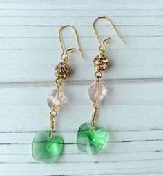 Sophisticated dangle earring with Swarovski green apple faceted crystal and blush Swarovski pave that add eye catching shimmer to this stunning set. Lightweight earrings with a 2 3/4 inch drop on gold plated, nickel free ear wires. Makes a great gift or a little something special to treat yourself with. Thank you for visiting my Etsy! May Birthstone Crystal Dangle Earrings For Party, Faceted Crystal Drop Earrings For Wedding, Elegant Green Earrings With Faceted Beads, Swarovski Crystal Drop Earrings, Earrings Inspiration, Granny Smith, Lightweight Earrings, Crystal Drop Earrings, Crystal Drop