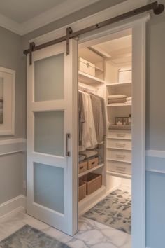 an open closet with clothes and other items in it