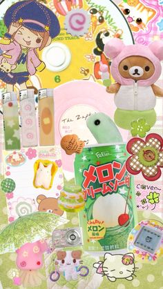 an assortment of stickers and toys on a table with a teddy bear in the background