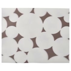 a brown and white polka dot pattern on fabric