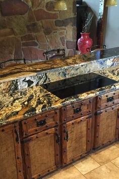 a kitchen counter top that has been made out of wood and granite with an open drawer underneath it