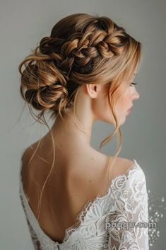 a woman wearing a wedding dress with braids in her hair