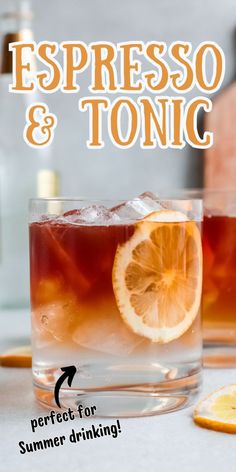 two glasses filled with liquid and lemons on top of a table next to an orange slice