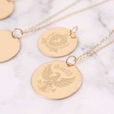 Embrace your heritage with our Custom Family Crest Necklace, exquisitely crafted from 14K solid gold. Each pendant is meticulously engraved with your personal coat of arms, making it a unique and meaningful gift for any occasion. Perfect for celebrating family history or as a cherished heirloom.  Make this timeless piece yours today and keep your family legacy close to your heart. Material: Solid Gold (real gold, no gold-filled or no gold plated material) Karat: 14 K (585) Available gold color: Yellow, rose, and white Available disc diameter: 12 mm, 14 mm, 16 mm, 18 mm, 20 mm The average thickness of the disc: 0.40 mm *The Chain on the photo is type #3 You can customize the chain length from 16" to 24". The "cable chain" is used for this necklace. You can write for longer and different cha Personal Coat Of Arms, Family Crest Necklace, Heritage Jewellery, Heirloom Gifts, Family Legacy, Chain Extenders, Cross Jewelry, Evil Eye Jewelry, Necklace Personalized